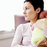 Mother In Nursery Suffering From Post Natal Depression